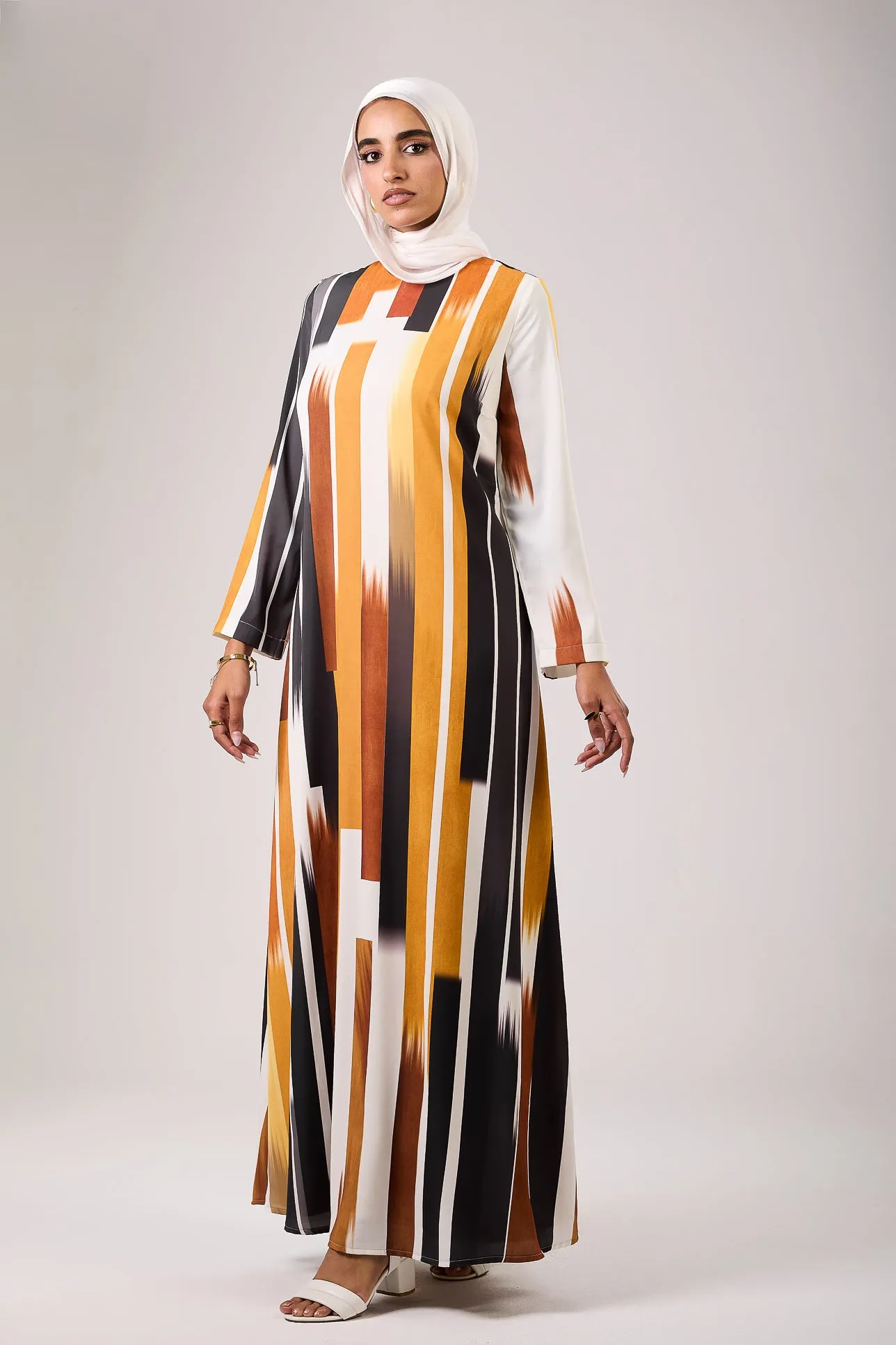 Feryal Timeless Elegance Satin Maxi Dress with Linear Patterns